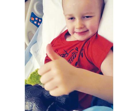 Ami Wilson/Contributing Photographer Dallas Wilson, 3, of Brasstown, suffered severe brain injuries in a freak accident on Jan. 27. He has made a miraculous recovery while still giving his signature thumbs-up.
