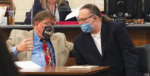 Quintin Ellison/District Attorney’s Office Defense attorney Rich Cassady (left) speaks with his client, Jackie Slaughter, at trial last week in the Cherokee County Courthouse.