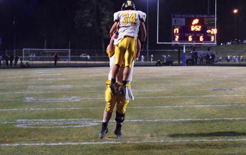  Justin Fitzgerald/sports@cherokeescout.com Murphy running back Ty Laney is lifted high into the air after scoring a touchdown during Murphy’s 29-24 win over Elkin. The Bulldogs will take on Robbinsville this Friday night, with the winner advancing to the state 1A championship game.