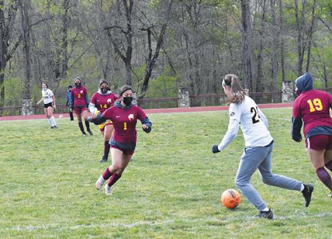 Justin Fitzgerald/sports@cherokeescout.com Murphy freshman Lailee Hollaway looks to dribble around a Cherokee defender during the Lady Bulldogs’ 7-0 win over Cherokee on April 21. Holloway scored five goals in the game.