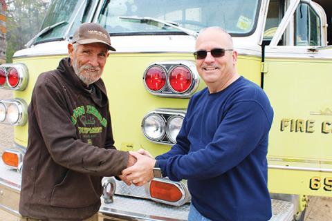 Photos by Charlie Benton/cbenton@cherokeescout.com Johnny Shields of Ranger turns over a 1977 American LaFrance fire engine that had previously served the Ranger Volunteer Fire Department to retired Somerdale, N.J., volunteer firefighter Frank Rizzo. Rizzo served on the Somerdale department at the time the truck was delivered brand new.
