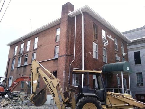 Cameron Killian/Contributing Photographer The Cherokee County Jail was located behind the courthouse (main street entrance shown here) cells on the top two floors. The jail is pictured as demolition work began, the courthouse (seen at right) renovated and expanded to cover the old site.