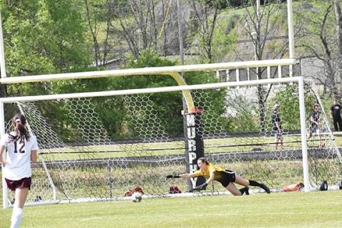 Justin Fitzgerald/sports@cherokeescout.com Murphy goalie Torin Rogers dives for the ball during the Lady Bulldogs’ 5-1 loss to Swain County on Friday afternoon.