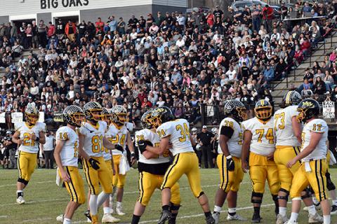 Justin Fitzgerald/sports@cherokeescout.com Murphy running back Ty Laney celebrates with offensive lineman Jonathan Hemby after scoring his second touchdown in a 24-14 win over Robbinsville. The Bulldogs play Northside-Pinetown in the state championship Saturday.