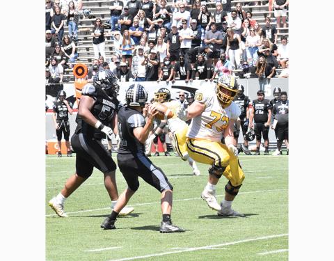 Justin Fitzgerald/sports@cherokeescout.com Murphy offensive lineman Yousef Mugharbil looks to bring down Northside-Pinetown quarterback Keifer Boyd during the Bulldogs 14-7 win over the Panthers in the 1A state championship game on May 8.