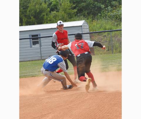Justin Fitzgerald/sports@cherokeescout.com Hiwassee Dam’s Kyle Taylor avoids Andrews AJ Weaver’s tag at second base during the Wildcats’ 3-2 win over the Eagles on Friday.