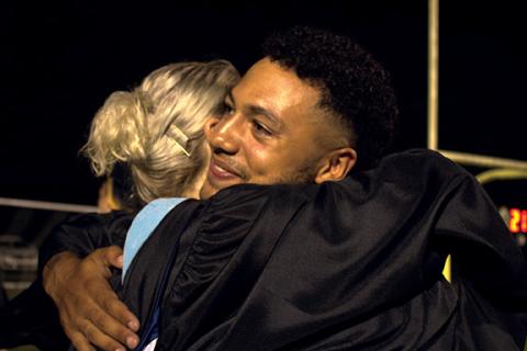 Charlie Benton/cbenton@cherokeescout.com  Murphy High School graduate Abram Abling hugs assistant principal Wendy Leatherwood after the school’s graduation ceremony Friday night. More photos, 4A, 7A.