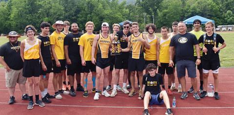 Photos by Justin Fitzgerald/address@cherokeescout.com The Murphy boys track and field team celebrates winning its fourth straight Smoky Mountain Conference championship. From left are throwing coach Jay Raxter, Mathew Stalcup, Cameron Grooms, Hunter Laney, Connor McMillian, Rashad Davis, Will Johnson, Chandler Wood, Hunter Stalcup, Dalton Moore, Drew Hodge,  Caleb Rice, Liam Cook, Clayton Laney, head coach Davis Bryant, Mann Barrot and Caleb Jones. Sitting is Chase Pierce.