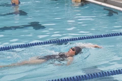 Ariana Rivas nears the wall swimming backstroke during Cherokee County Aquatic Club practice on July 13.