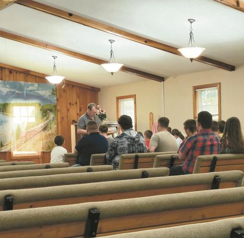 Hoyt Brown, pastor of Old Fashioned Baptist Church, tells a faith-based story to teenage vacation Bible school attendees on July 14.