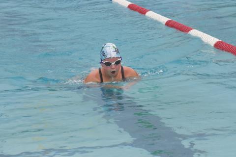 Ansley Roper comes up for air while swimming breaststroke.