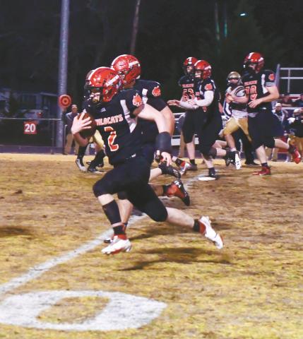 Andrews running back Isaac Weaver tries to find the angle against two Hayesville defenders in a 40-20 win over the Yellow Jackets on March 19.
