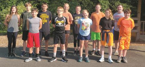 The new cross-country teams at The Learning Center charter school have begun practice for the upcoming season. From left are Carlee Catuto (TLC alumni junior coach), Logan DiCicco (TLC alumni junior coach), Anthony Catuto, Ashton Raxter, Branson Crocker, Jaden Crocker, Grace Adams, Amelia Manning, Robert Manning, Ember Crisp, coach Mike Catuto and Braden Dockery.