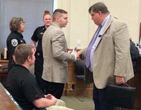 James Allen Bass and defense attorney Rich Cassady shake hands following a 'not guilty' verdict last week.