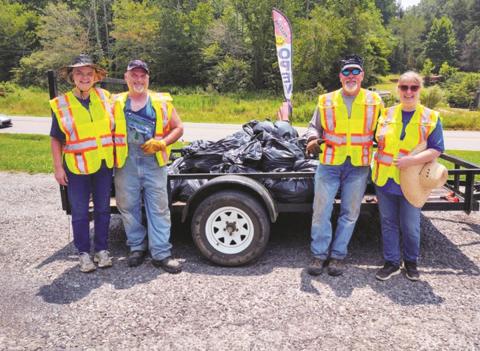 After five hours of cleaning up trash, a four-member team collected more than 30 bags of trash weighing about 750 pounds. Shown are (from left) Patty Freeman, Ronney Freeman, Jeff Thomason and Dee Dee Deal of Turtletown who came together July 24 to pick up trash along Runion Road.