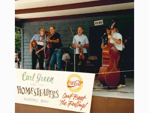Georgia Mountain Fair photo In early 1990s show in Hiawassee, Ga., local band Carl Green and the Homesteaders close out the final set with “Angel Band,” a gospel number. From left are band members Bobby Thompson, Wally Avett, fiddler Carl Green, and Martha and David Liden.