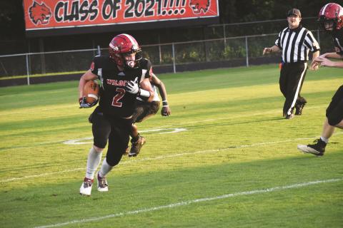 Andrews’ Isaac Weaver runs up field on a punt return during the Wildcats’ 36-11 win over the Hickory Hawks on Friday. Weaver scored four touchdowns in the win.