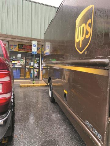 A UPS delivery truck uses a handicap parking space in downtown Murphy. 