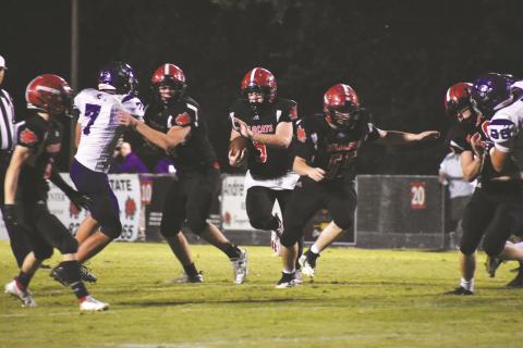 Andrews’ Austin Martin looks for room to run during the Wildcats 26-14 win over Mitchell on Sept. 10.