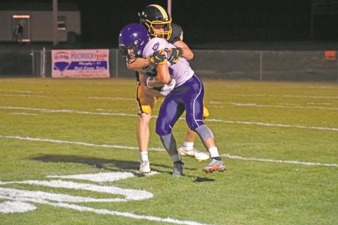 Murphy’s Will Johnson tries to wrap up Georgia Force Christian running back Cam Newman during the Bulldogs’ 58-14 win Friday night over the Blue Knights.