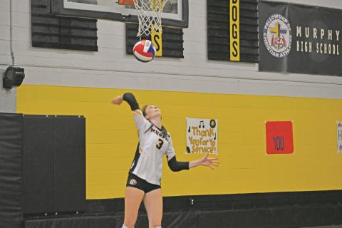 Murphy sophomore Cali Rumfelt serves the ball during Murphy’s straight-set win over Swain County on Sept. 9.