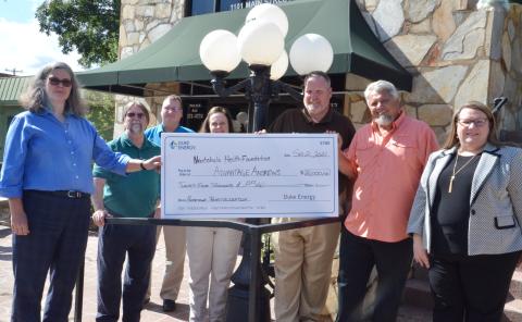 Duke Energy District Manager Lisa Leatherman (left) presents Nantahala Health Foundation Executive Director Lori Bailey (right) with $25,000 for distribution to small businesses in Andrews as part of Duke’s Hometown Revitalization Program. Also pictured are (from left) Tom O’Brien, CEO of Industrial Opportunities Inc.; Tim Radford, owner of WKRK radio; Lisa Duff, associate director of the Nantahala Health Foundation; Lance Bristol, principal of Andrews High School; and Andrews Mayor James Reid. O’Brien, Rad