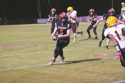 Andrews Austin Martin readies for contact after catching a pass against Cherokee in the Wildcats 12-9 loss to the Braves on Oct. 15.