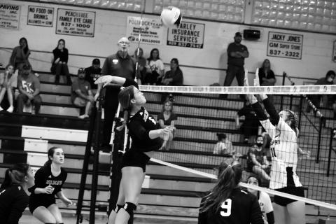Andrews’ Rylie McDonald tries to hit the ball past Murphy’s Torin Rogers during the Lady Bulldogs’ 3-0 win over the Lady Wildcats on Thursday.