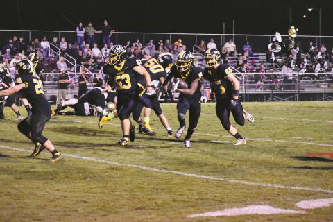 Murphy’s Juan Allen eyes the end zone for the first of his three touchdowns in a 56-14 win over Hayesville on Friday.