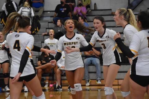 From left, Murphy’s Ashlyn Stroupe, Cailey Dockery, Olivia Payne, Calista Rumfelt, Torin Rogers and Amber Martin celebrate after scoring a point against Cherokee on Sept. 30.