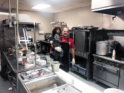 Photos by Abigail Hickman/Staff Correspondent Frank Colontonio, with grandson Jayden, cooks family recipes at Granieri’s Italian Restaurant.