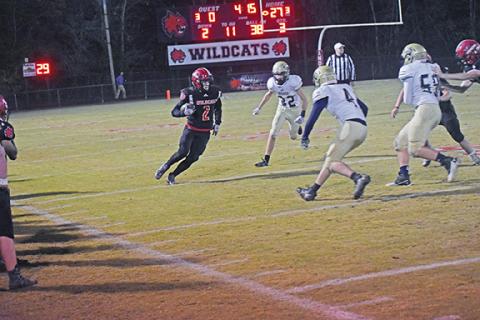 Justin Fitzgerald/sports@cherokeescout.com Andrews Isaac Weaver looks to cut up field during the Wildcats’ 34-6 win over Bishop McGuinness on Nov. 5. The Wildcats season came to an end in overtime Friday night.