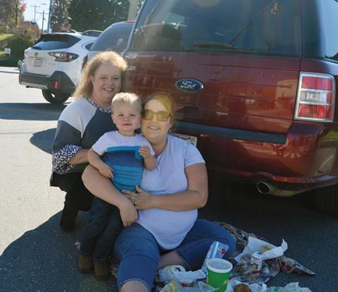 Photos by Abigail Hickman/Staff Correspondent Mother Shanda Bias, daughter Madison Adamovish and son Stephen Adamovish make three generations watching the Veterans Parade.