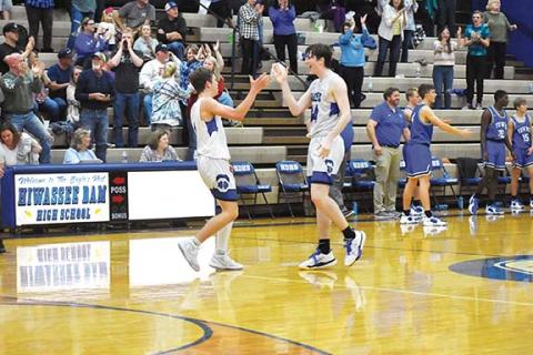 Justin Fitzgerald/sports@cherokeescout.com Hiwassee Dam’s Preston Hyde (left) and Sam Bradford (right) celebrate after the Eagles knocked off Towns County (Ga.) on Nov. 16.