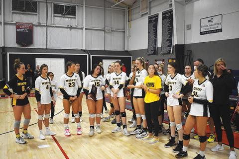 Justin Fitzgerald/sports@cherokeescout.com The Murphy volleyball team dejectedly accepts the 1A West Regional runner-up trophy after losing to Union Academy on Nov. 2.