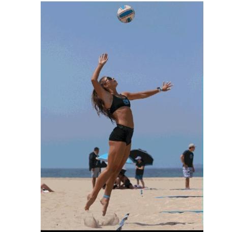 Murphy junior Olivia Payne serves during a beach volleyball match this summer. Despite it being her first summer playing, Payne was able to qualify for BVCA nationals.