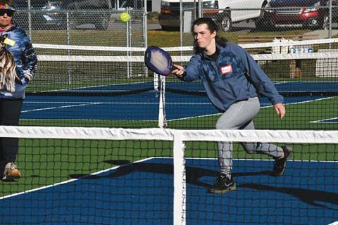 Justin Fitzgerald/sports@cherokeescout.com Murphy High School sophomore Andrew Barolet returns the ball during the Sports & Entertainment Marketing Class on Nov. 9 at Konehete Park.