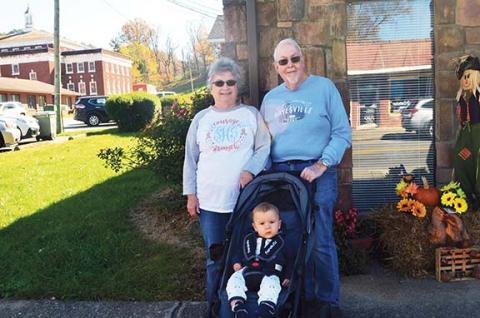 Paul and Suzanne Hedden, with 11-month-old Hudson Ashe, were on hand to support their daughter, history teacher Nicole Hedden, during the Nov. 11 event.