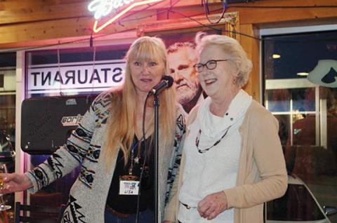Photos by Abigail Hickman/Staff Correspondent Lisa Pursell (left) and Melody Johnson oversee the fundraiser for the humane society.