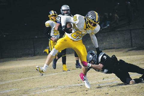 Photos by Justin Fitzgerald/sports@cherokeescout.com Murphy’s Will Johnson tries to escape a Robbinsville tackler during the Bulldogs’ 28-14 loss to the Black Knights on Friday night.