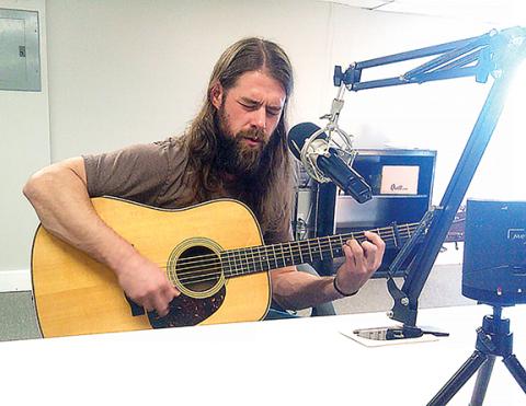 Brasstown native Andrew Chastain plays a tune during an interview with the Clay County Progress.