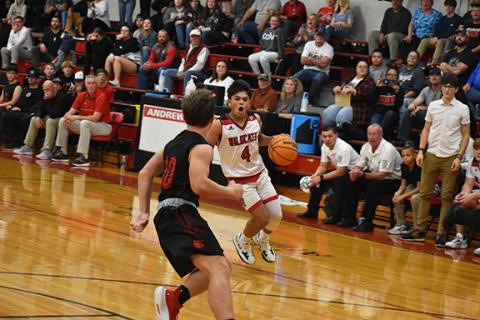 Justin Fitzgerald/sports@cherokeescout.com Wildcats freshman Kegan Ellis makes a move in an attempt to shake a defender during Andrews’ 75-58 loss to Franklin on Friday.