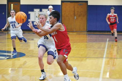 Justin Fitzgerald/sports@cherokeescout.com Andrews freshman Kegan Ellis tries to get a pass off in the Wildcats’ 54-49 loss on Hiwassee Dam on Dec. 7.