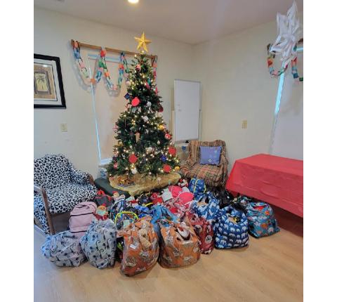 The Christmas tree this year at the Hurlburt-Johnson Friendship House was surrounded by gifts for residents of the homeless shelter thanks to the many donations of caring individuals from far and near.