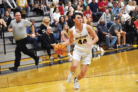 Justin Fitzgerald/sports@cherokeescout.com Murphy junior Will Carringer looks to drive or dish during the Bulldogs’ 67-52 win over Fannin County on Saturday.