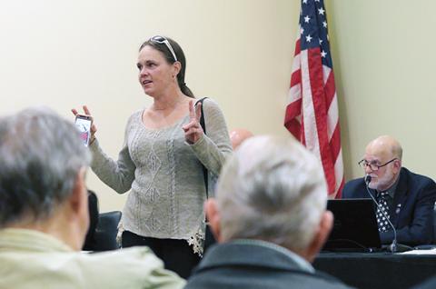 Jared Putnam/editor@cherokeescout.com Local resident Jenn Springer talks about why she is concerned about the crypto mining facility on Harshaw Road during the Dec. 6 county commission meeting.