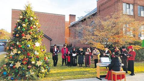 Photos by Bill Belian/Contributing Photographer The Victorian Singers share carols at the town Christmas tree during the eighth annual Christmas on Main in Andrews.
