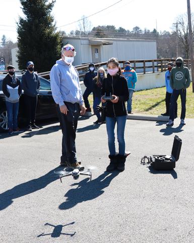 Abigail Hickman/Staff Correspondent  Wayne Bailey, a chief drone pilot who assists the state with programs, watches Tri-County Early College sophomore student Lisa Page operate a drone in class. 