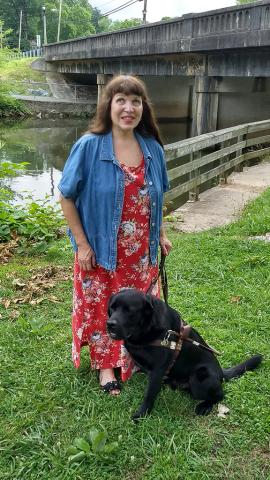 Abigail Hickman/Staff Correspondent Maria McLeod with her beloved guide dog, Grady.