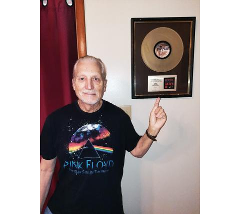 Bill Belian received a gold record from KISS in appreciation for all the work done on their complex staging.